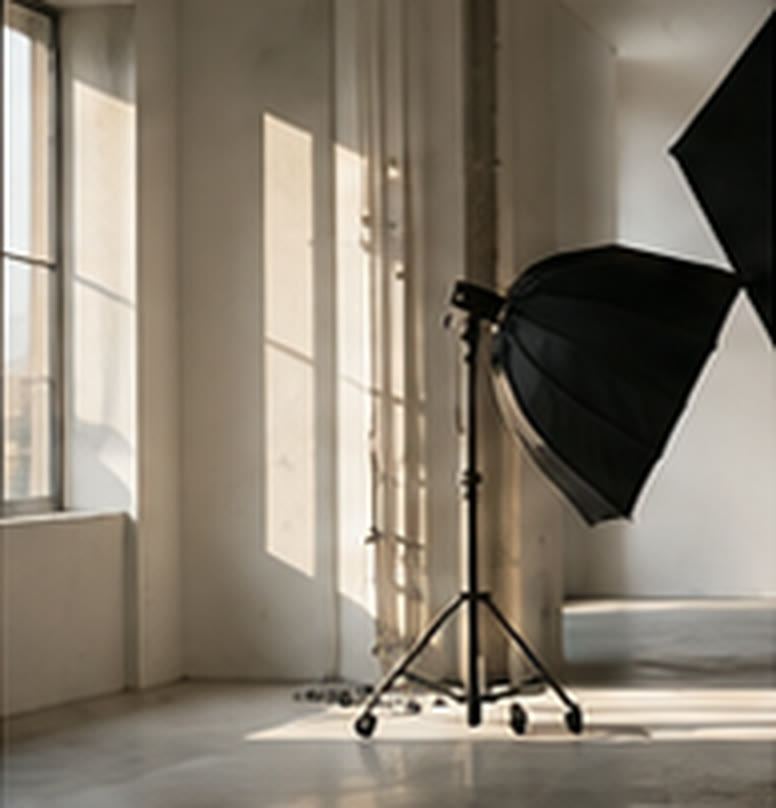 Cyclorama wall beside tall daylight windows